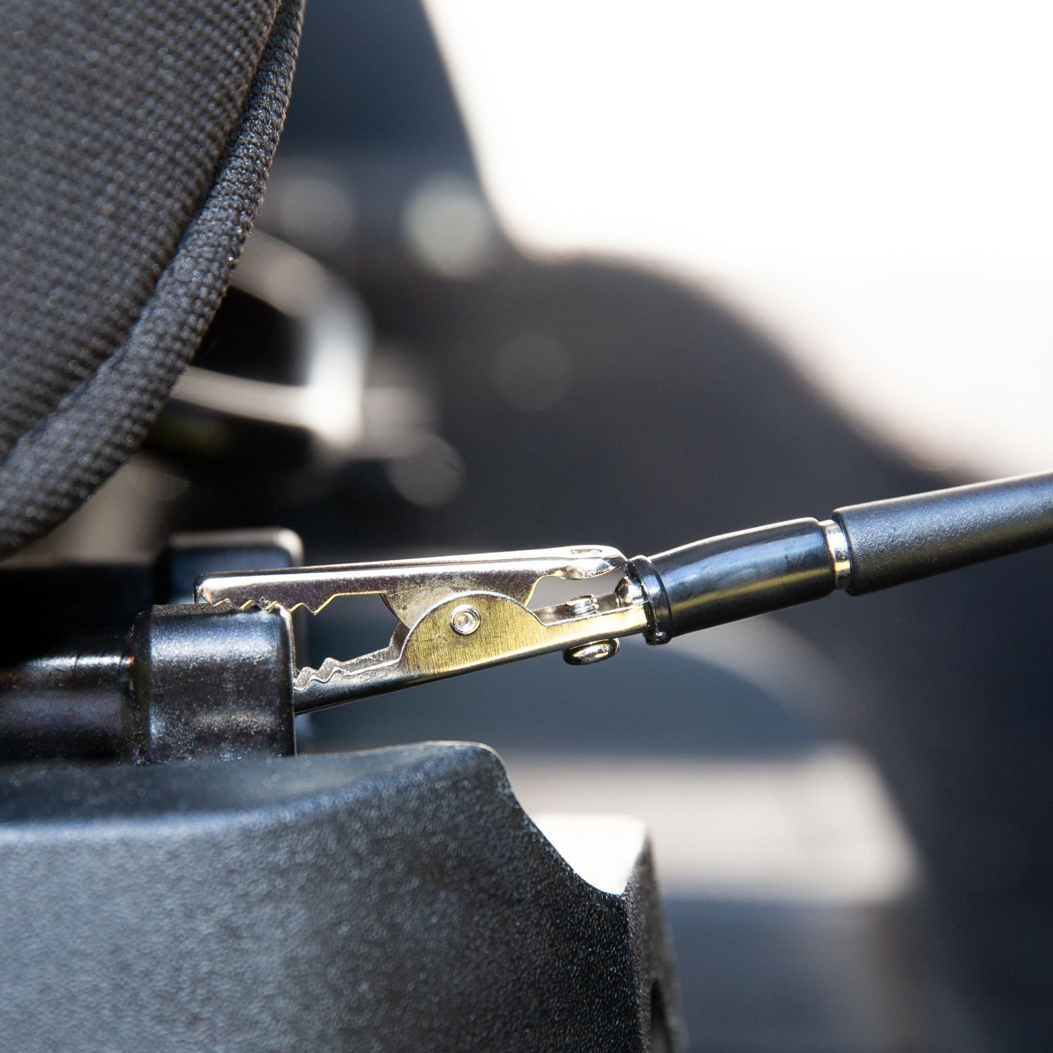 The Earthing Auto Seta Mat clips to the seat of your vehicle via an alligator clip to ground you while you drive. (4606623285361)