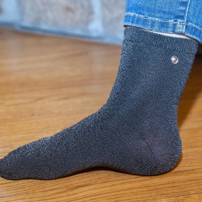  
                                    Wearing a grounded Earthing Sock for grounding indoors.  (6640015900785) 
                                
                                