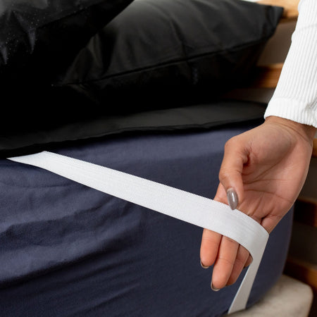 The durable Earthing Mattress Cover straps keep the cover in place all night long for grounded sleep. (4551374667889)